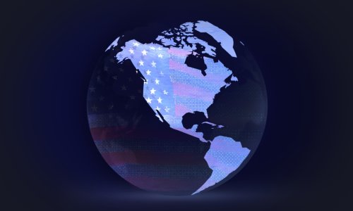 A globe with continents with the American flag looming in the background.